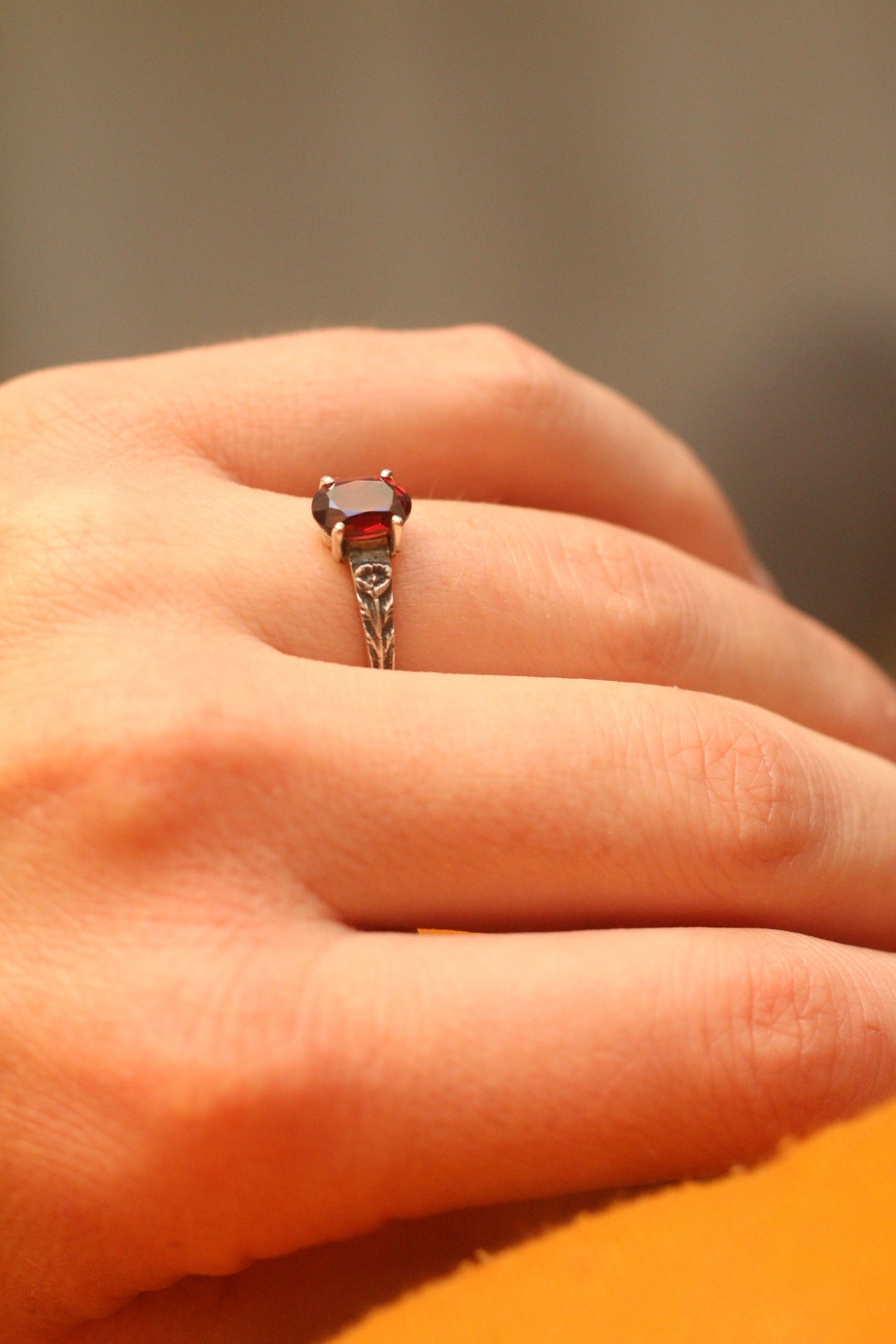 Silver poppy ring with prong set red garnet (preorder)
