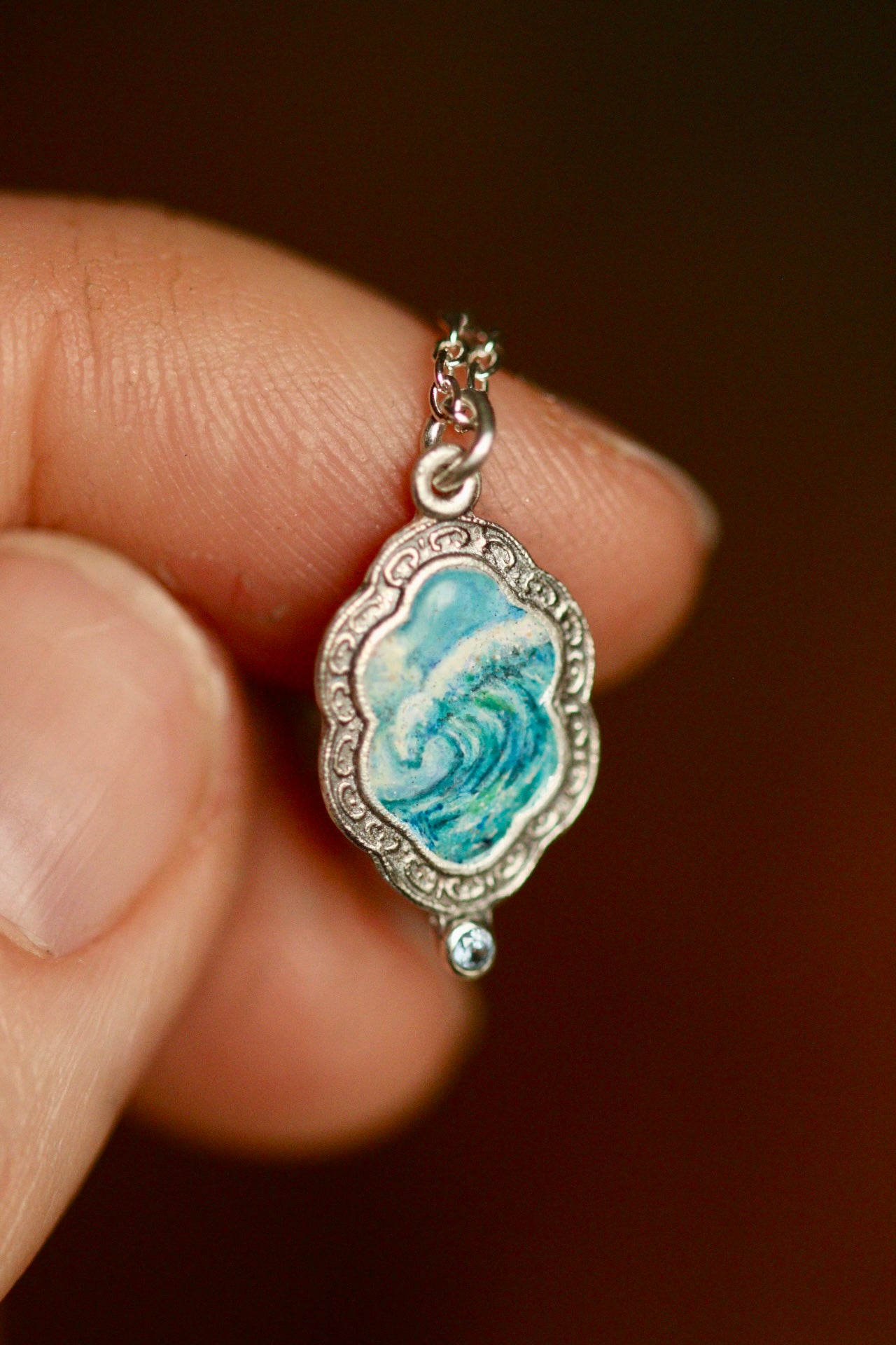 An awesome wave portal pendant