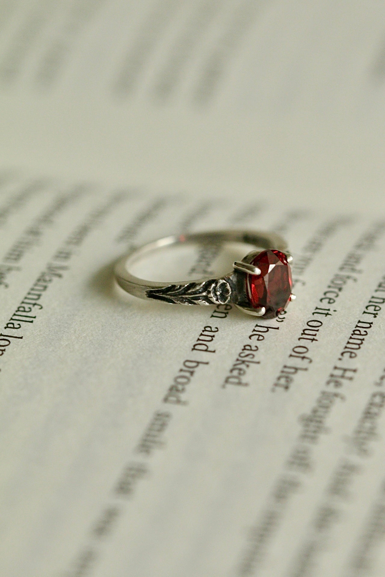 Silver poppy ring with prong set red garnet (preorder)