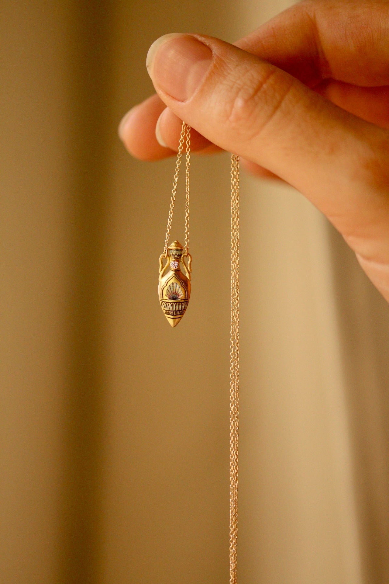 solid 14k gold amphora pendant with shell and sapphire