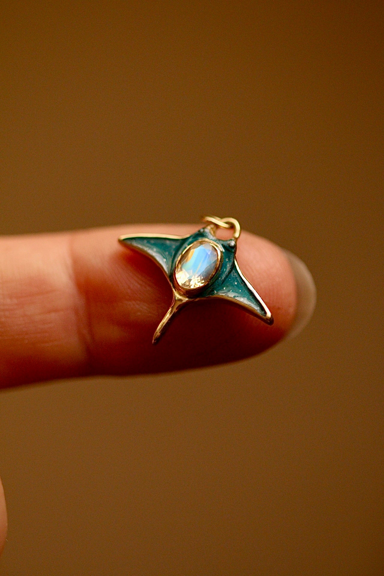 Solid 18k gold manta ray pendant with moonstone