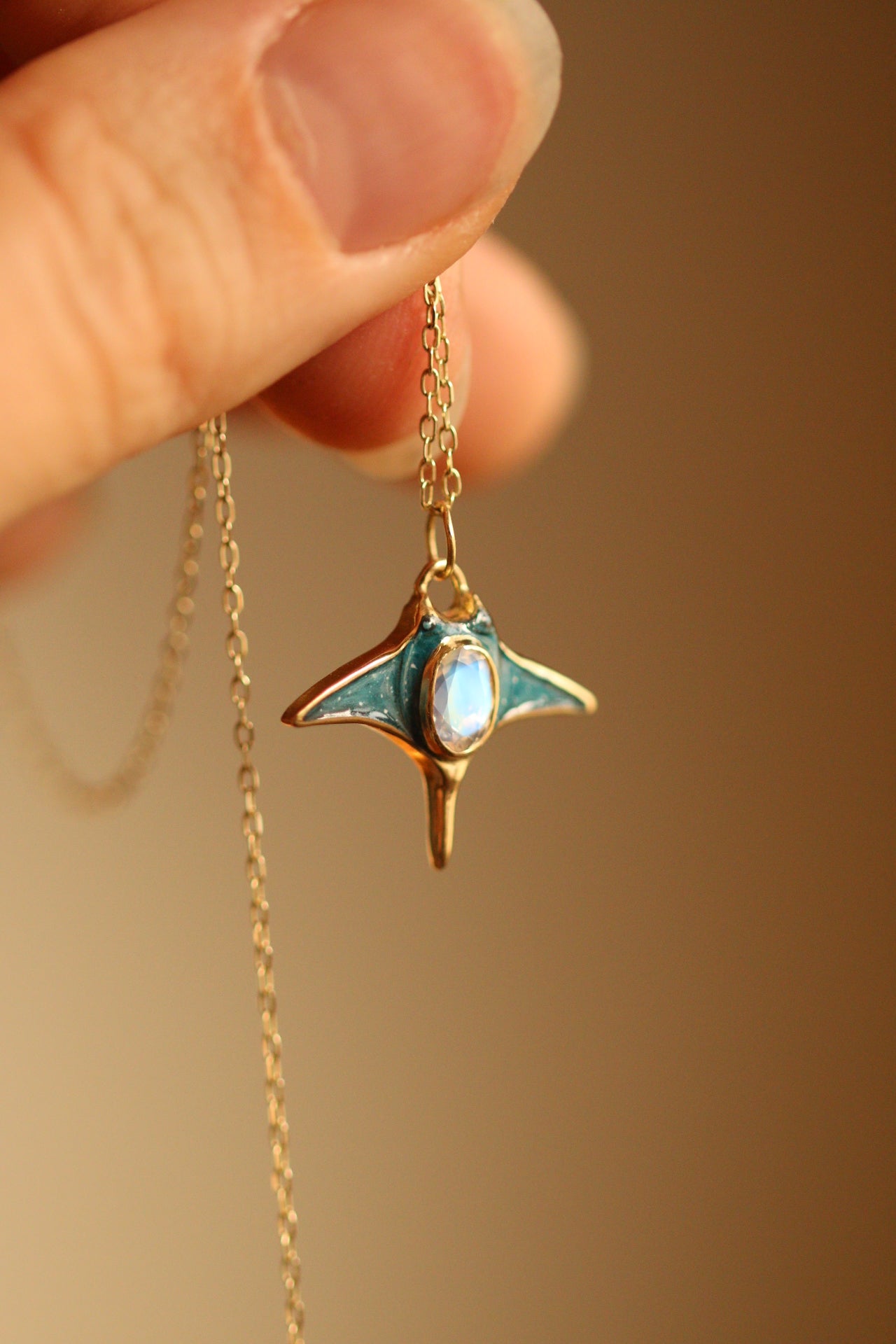 Solid 18k gold manta ray pendant with moonstone