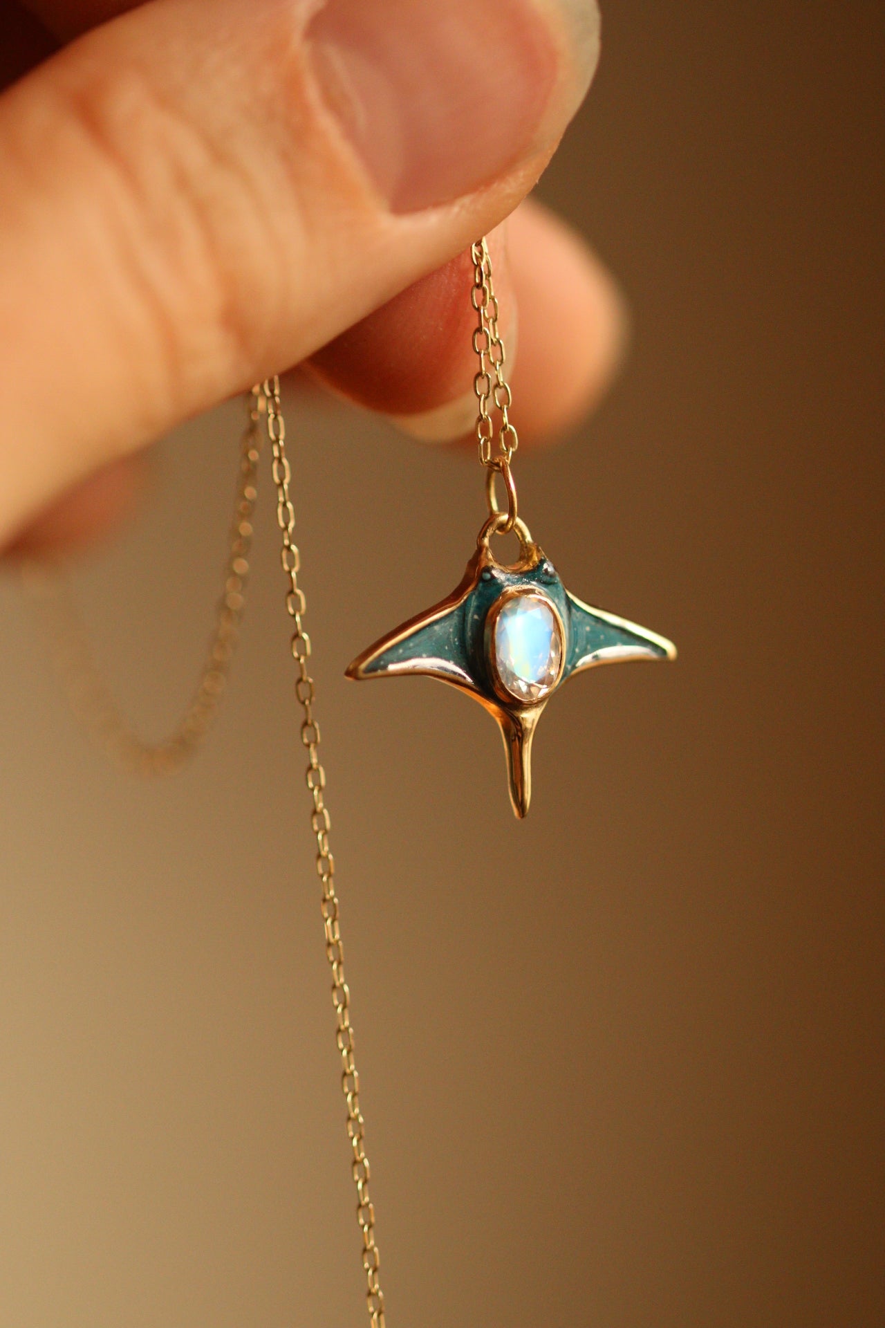 Solid 18k gold manta ray pendant with moonstone