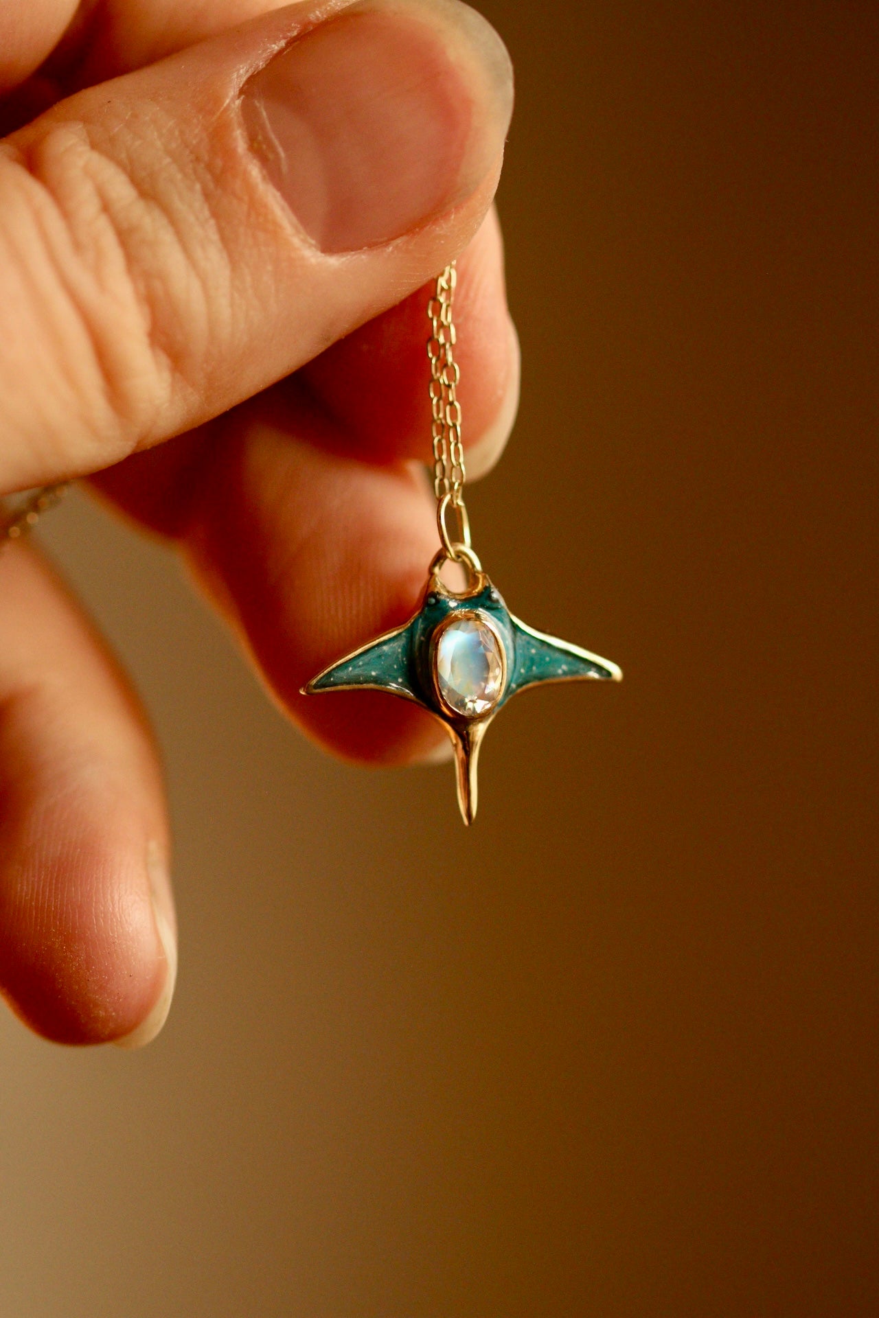 Solid 18k gold manta ray pendant with moonstone