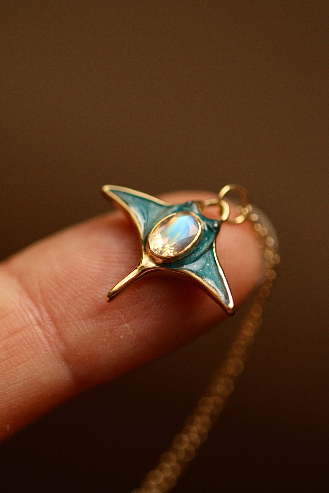 Solid 18k gold manta ray pendant with moonstone