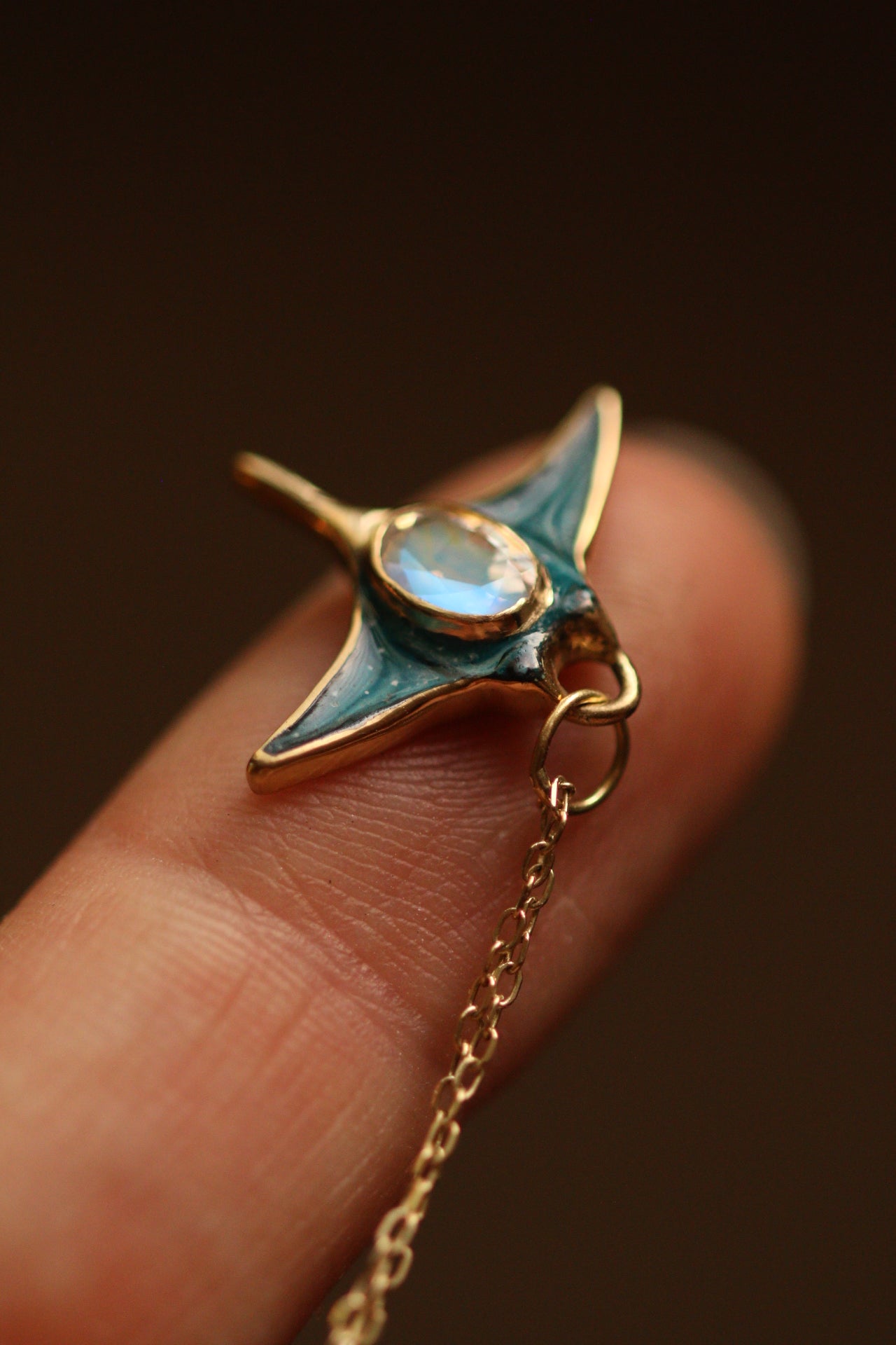 Solid 18k gold manta ray pendant with moonstone