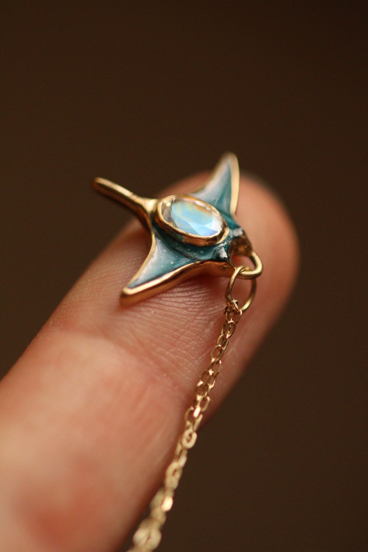 Solid 18k gold manta ray pendant with moonstone