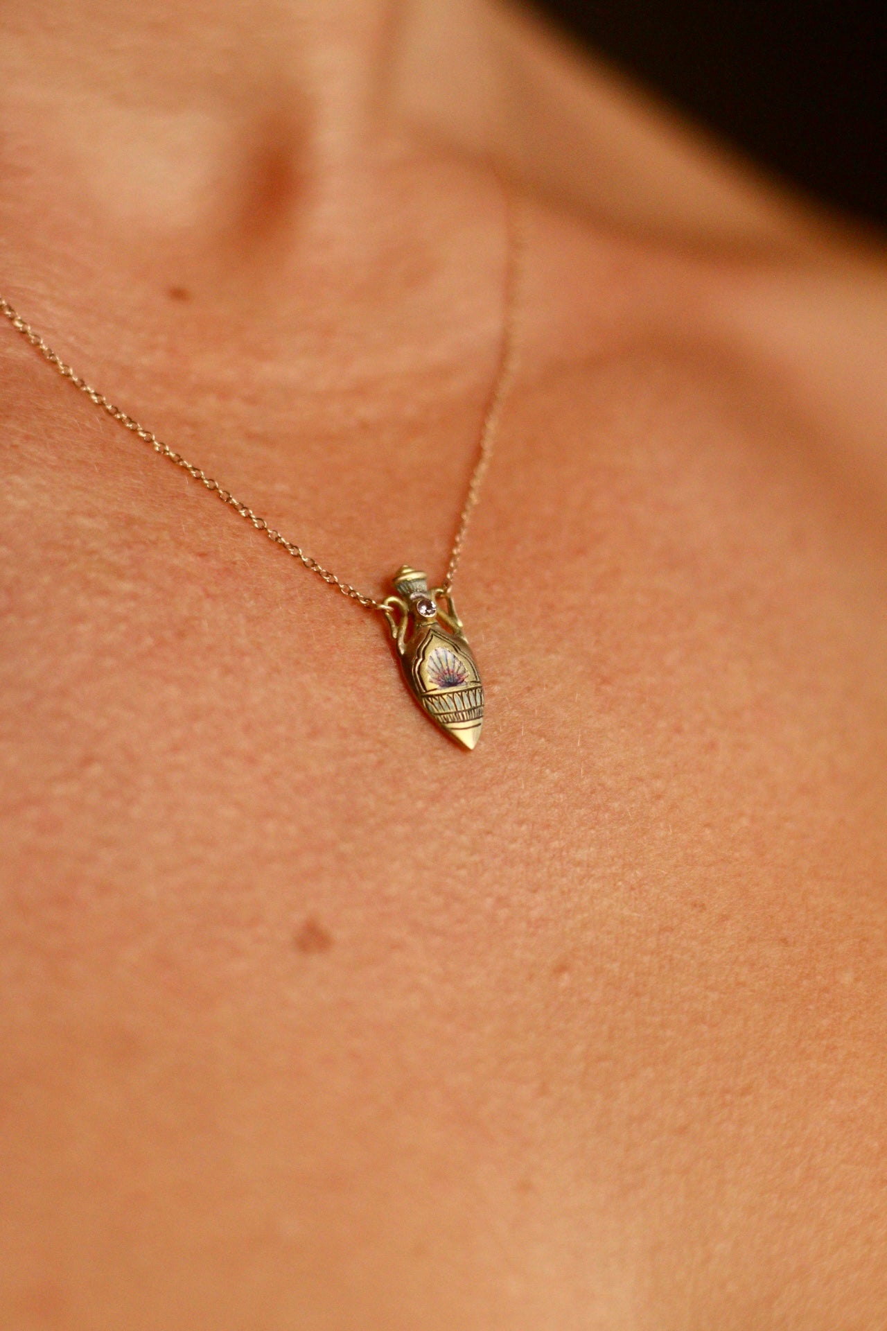 solid 14k gold amphora pendant with shell and sapphire