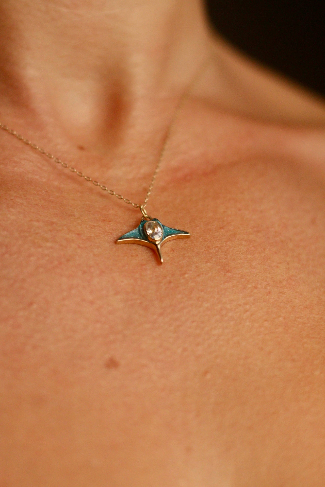 Solid 18k gold manta ray pendant with moonstone