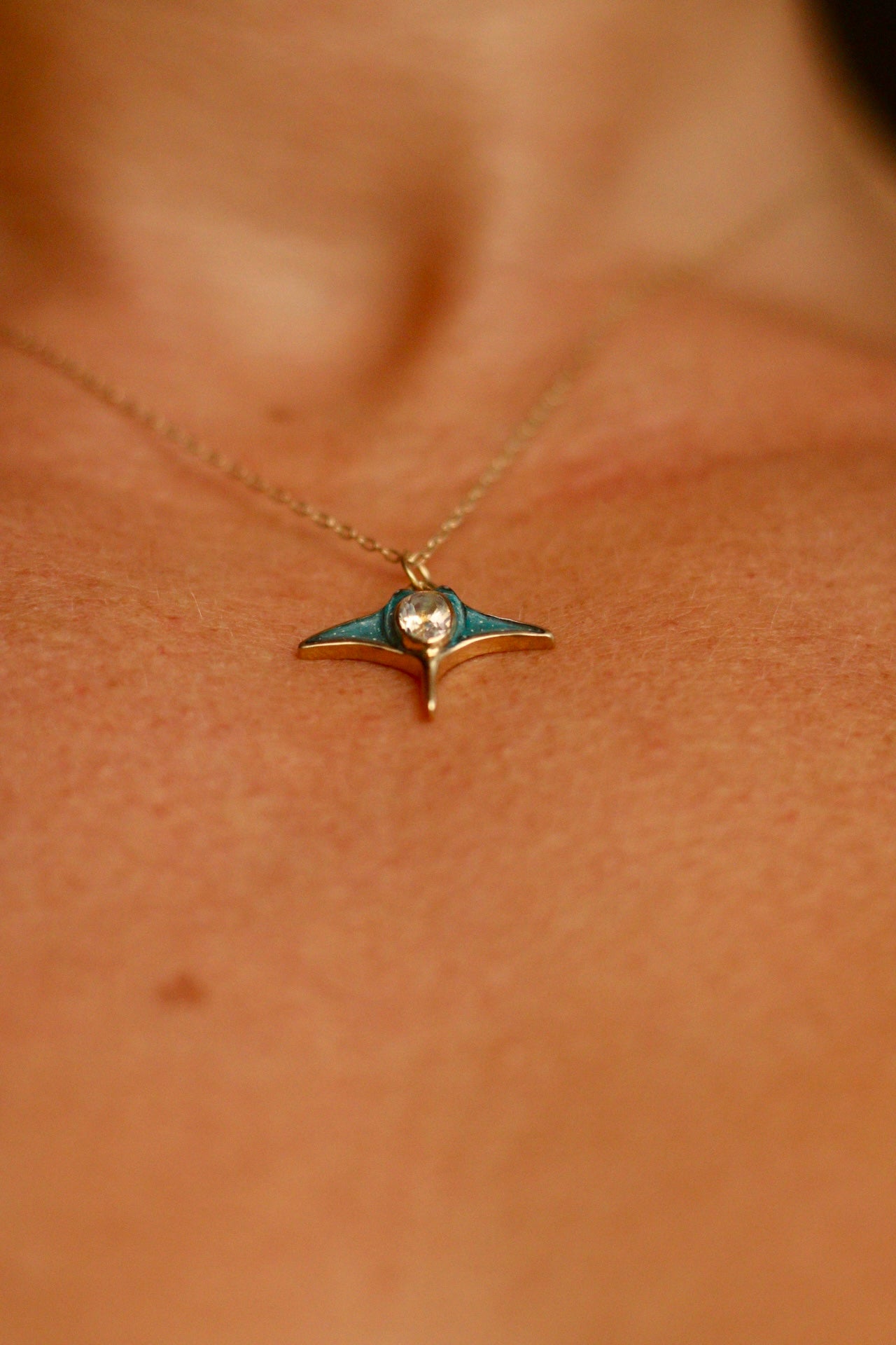 Solid 18k gold manta ray pendant with moonstone
