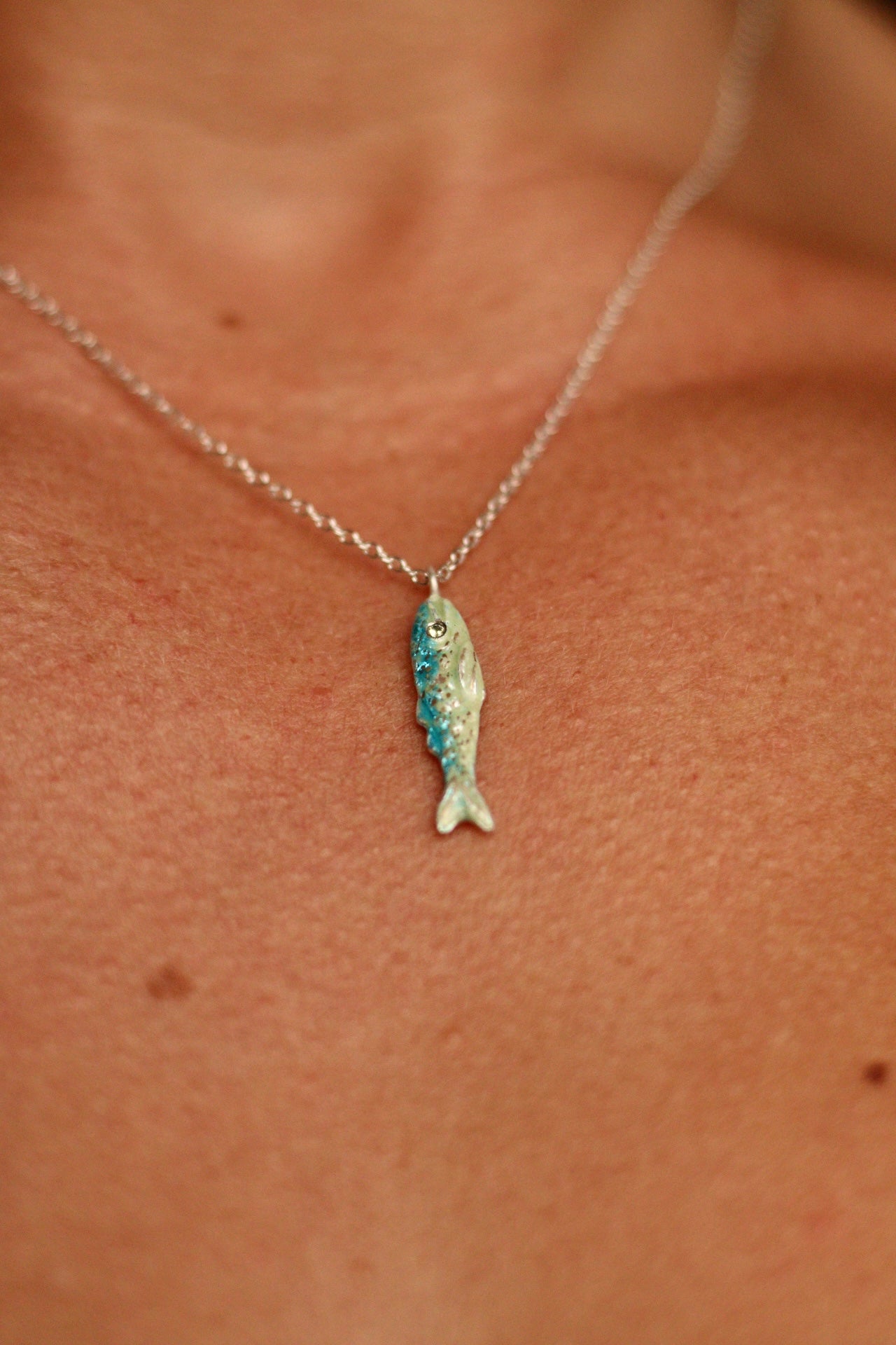 Enamel fish pendant with sapphire