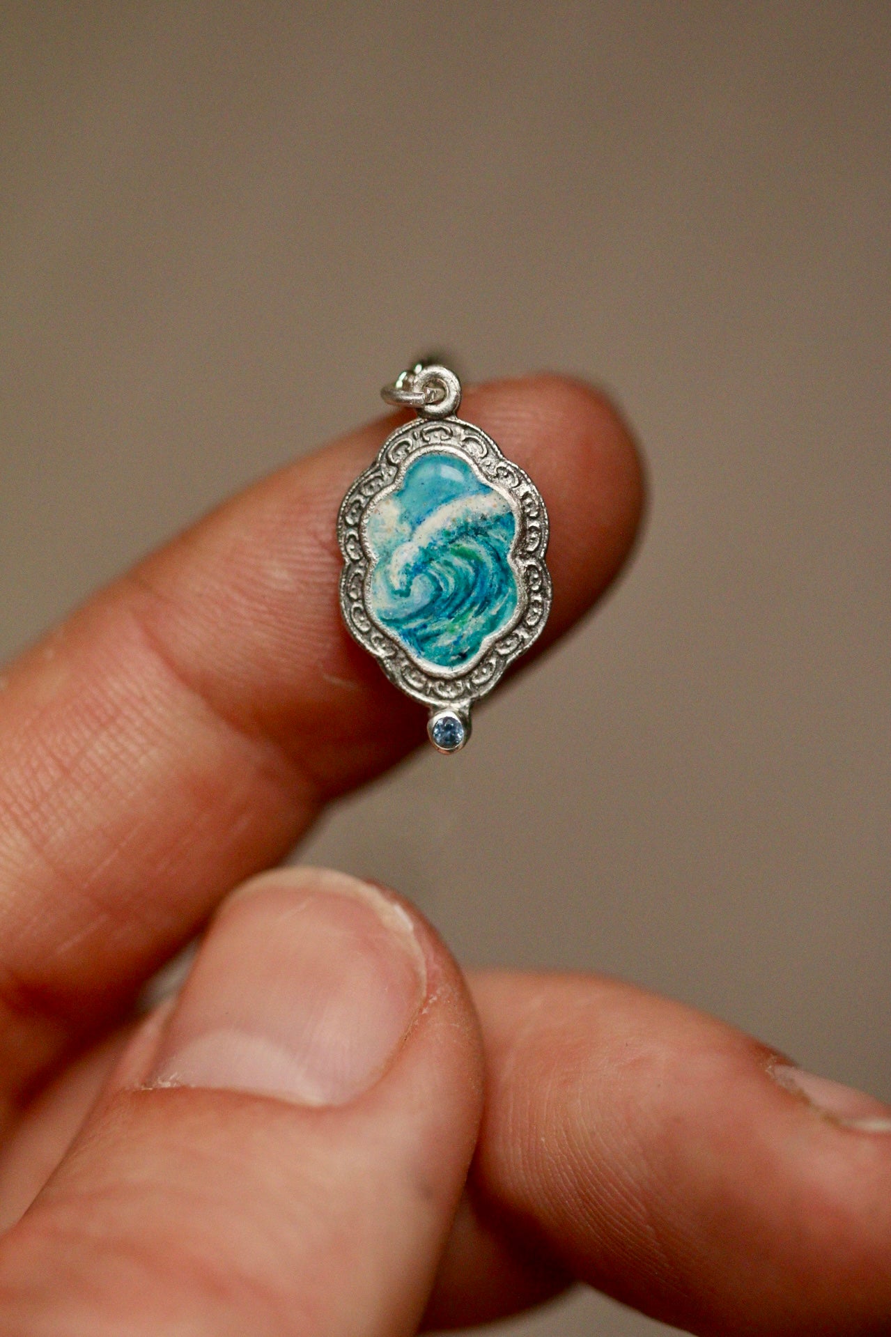 An awesome wave portal pendant