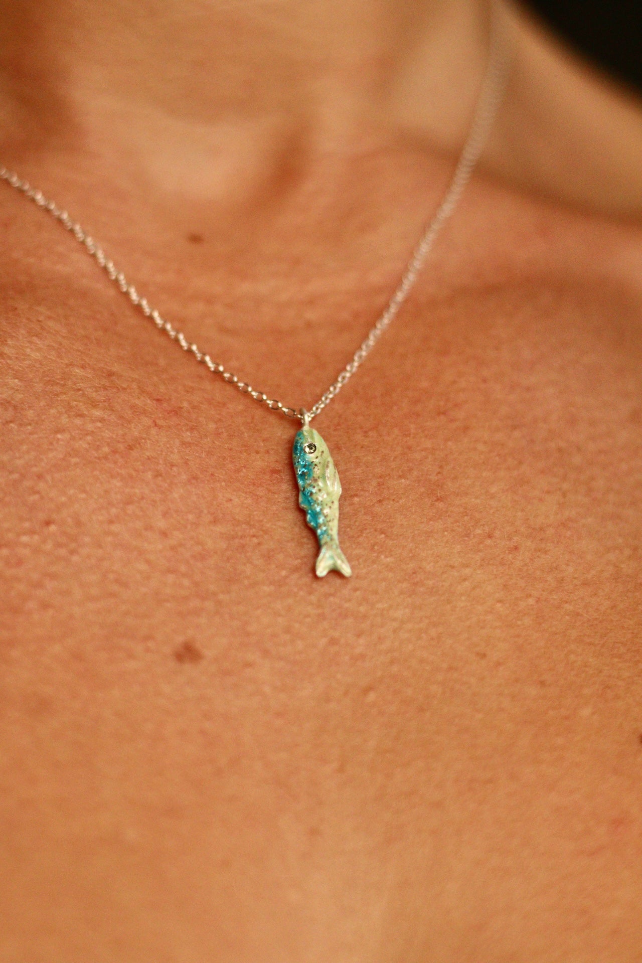 Enamel fish pendant with sapphire