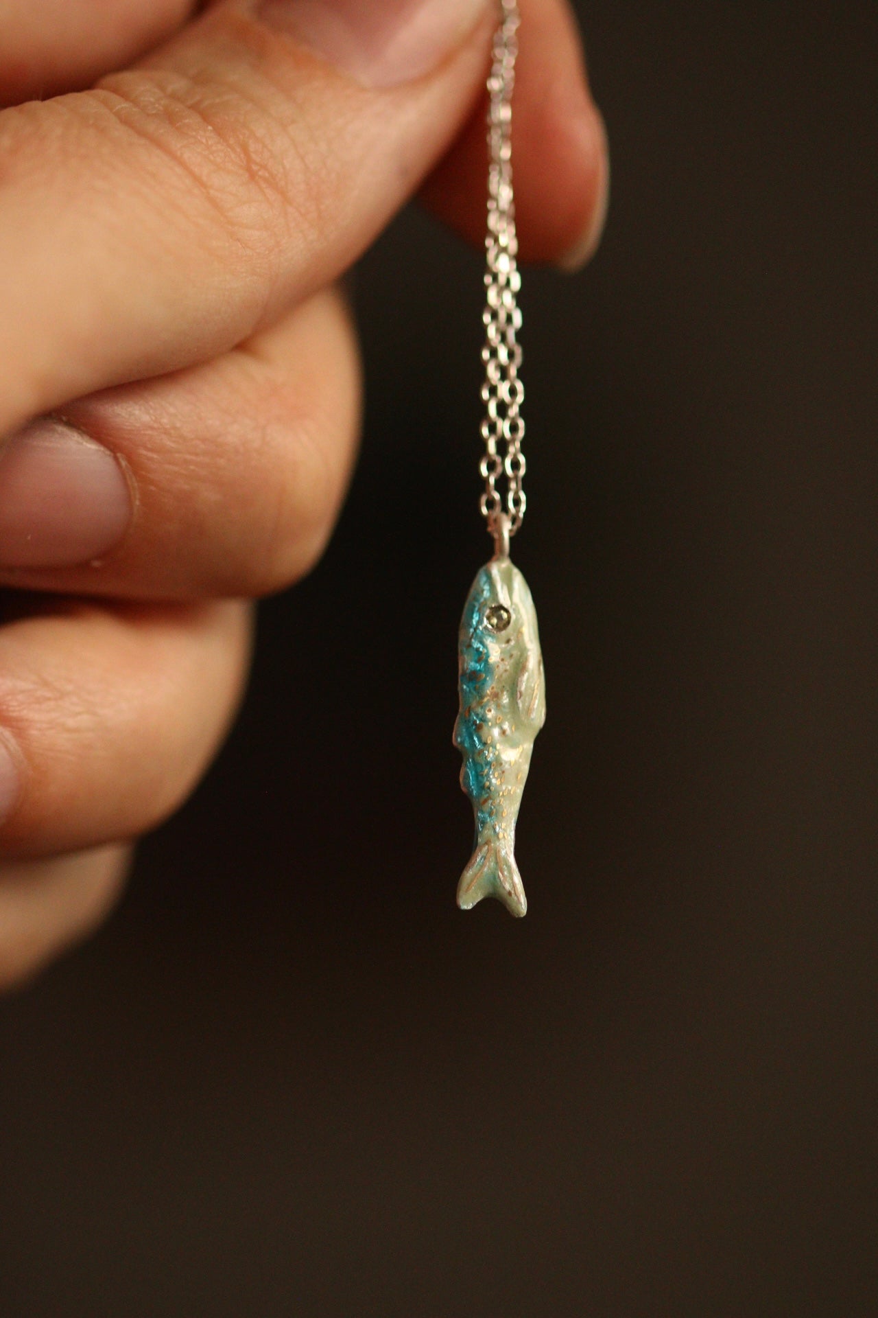 Enamel fish pendant with sapphire