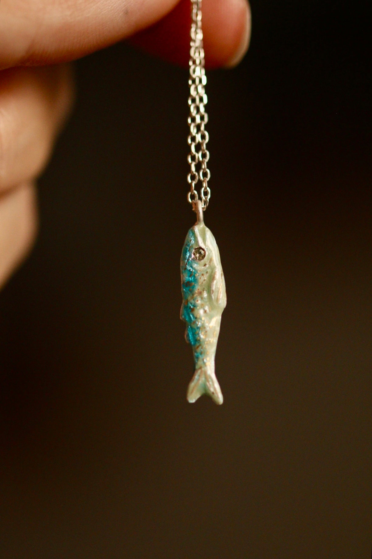 Enamel fish pendant with sapphire