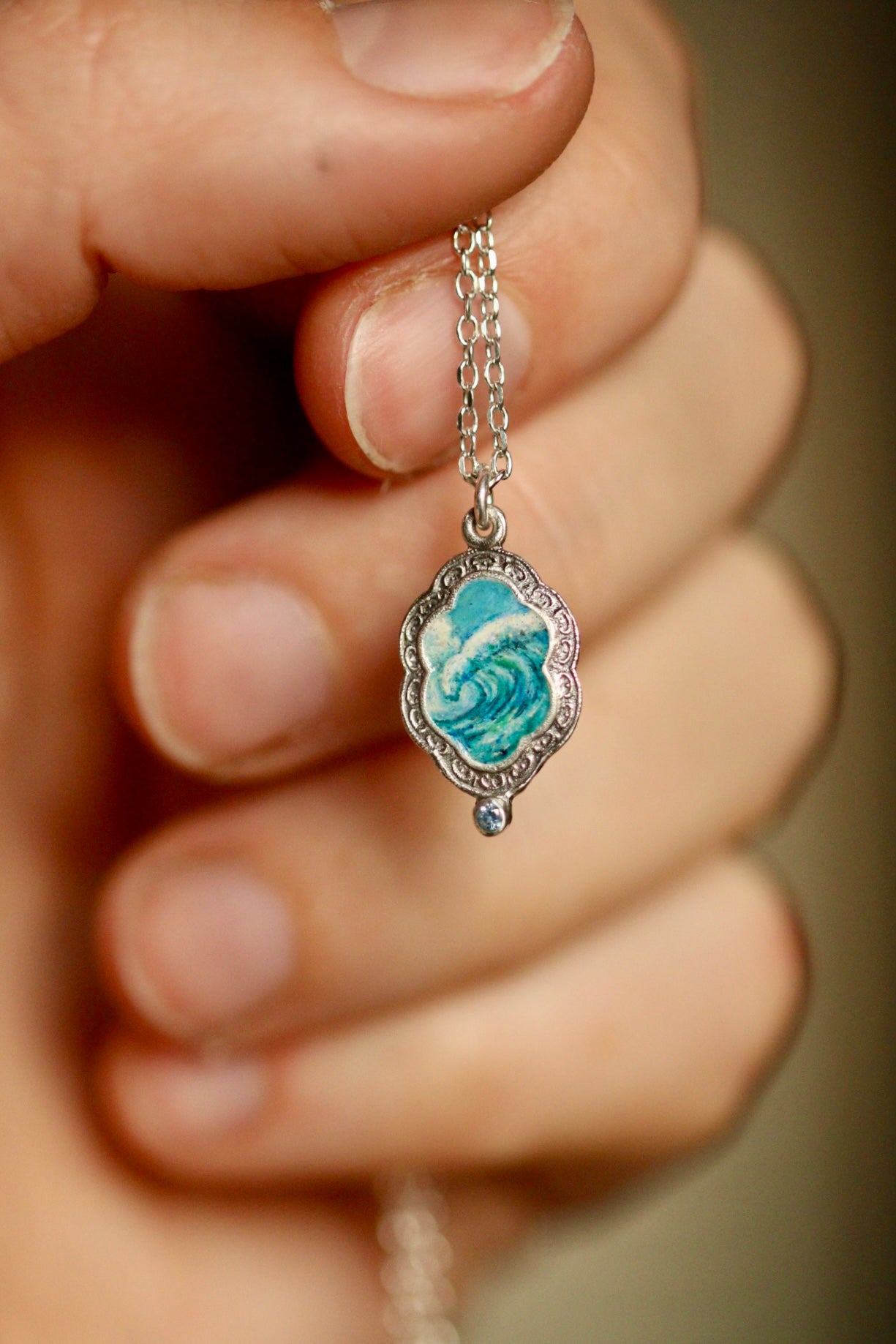 An awesome wave portal pendant