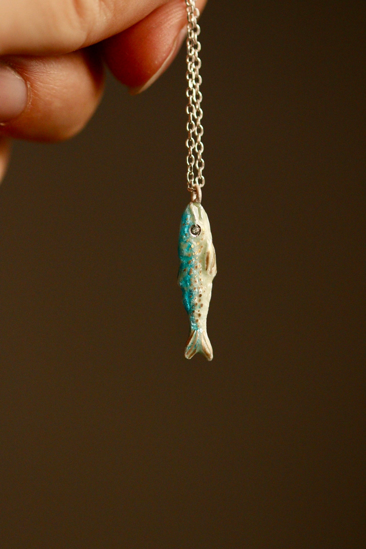 Enamel fish pendant with sapphire