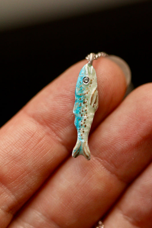 Enamel fish pendant with sapphire
