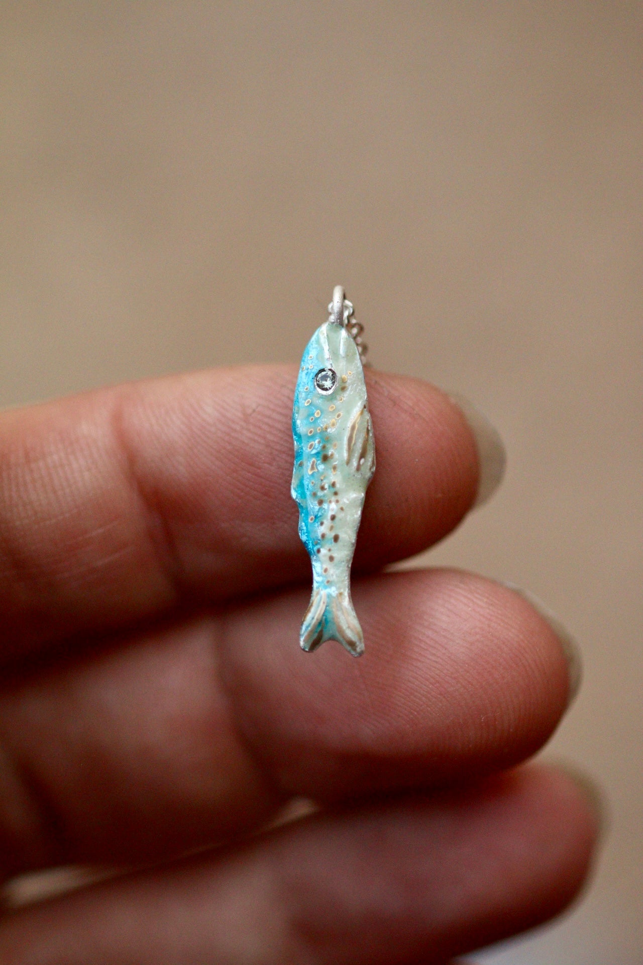 Enamel fish pendant with sapphire