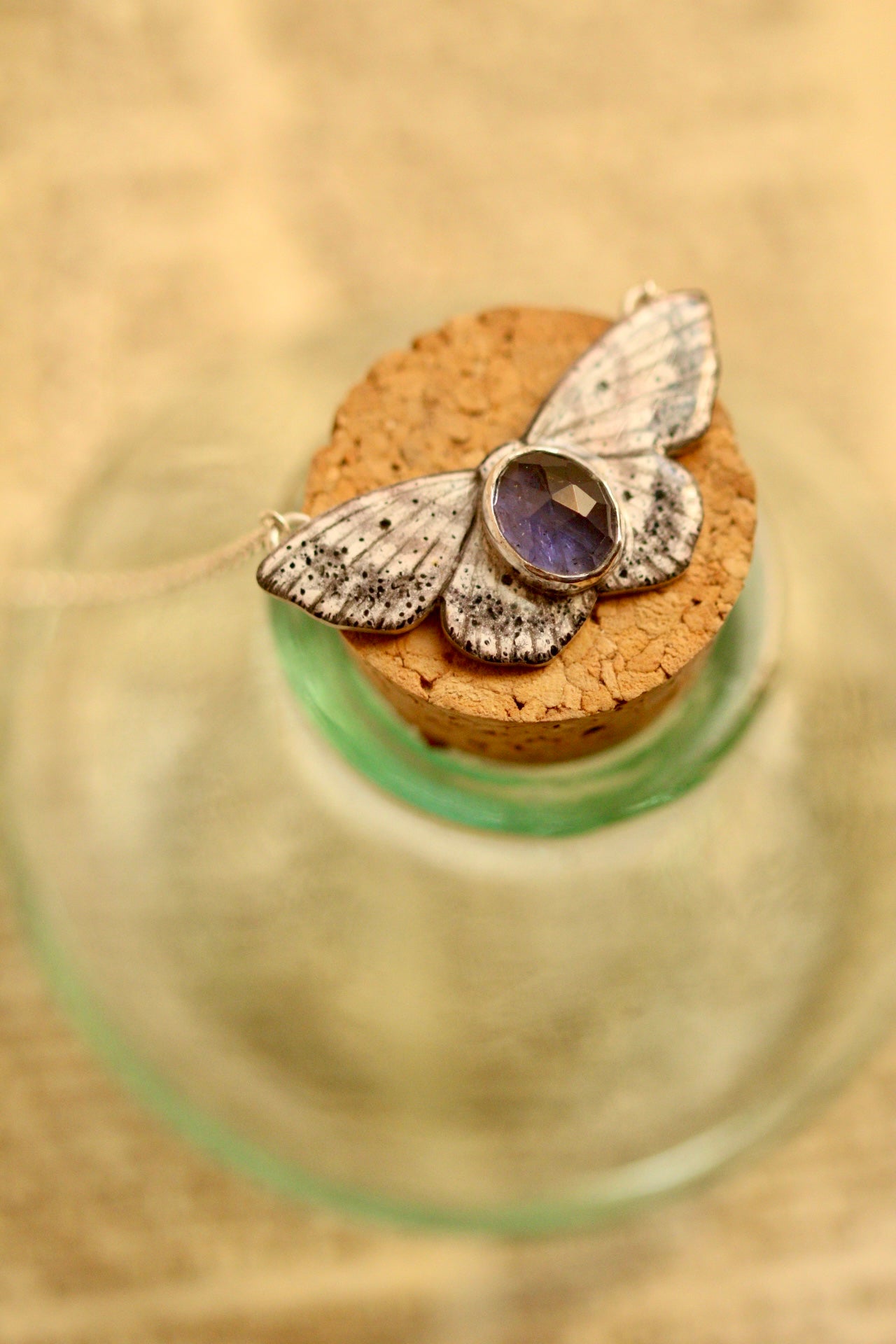 Lace moth pendant