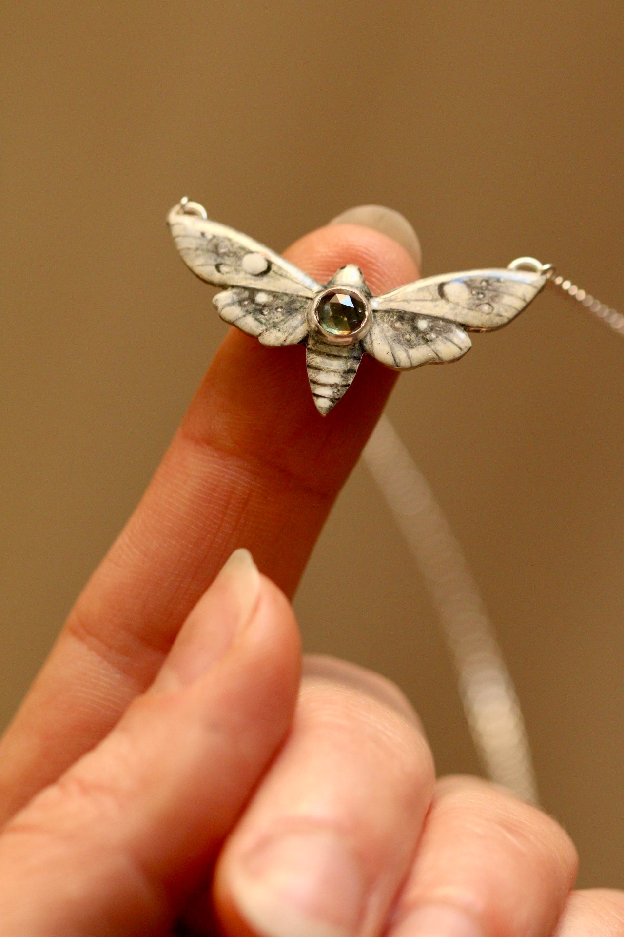 White moth pendant