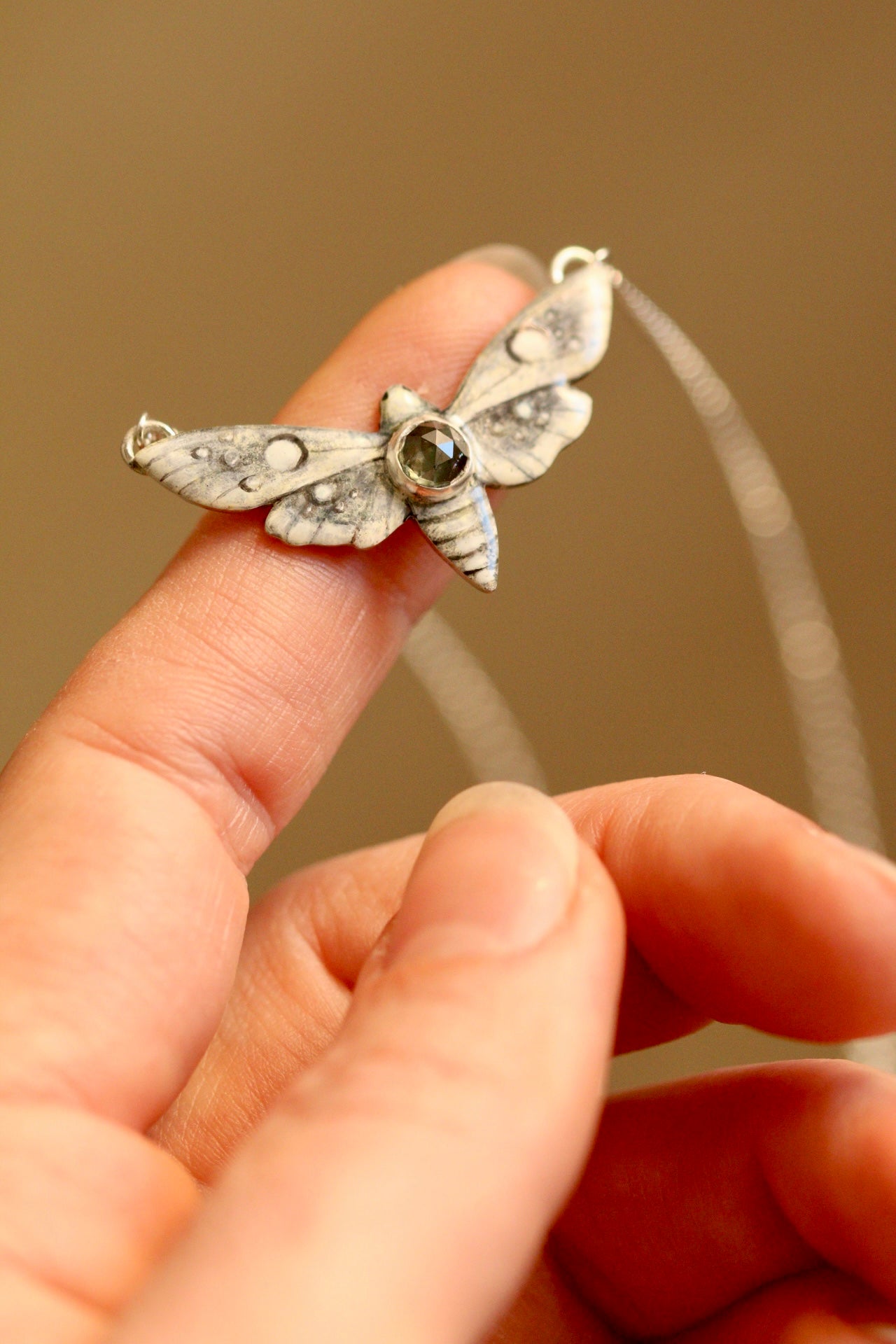 White moth pendant