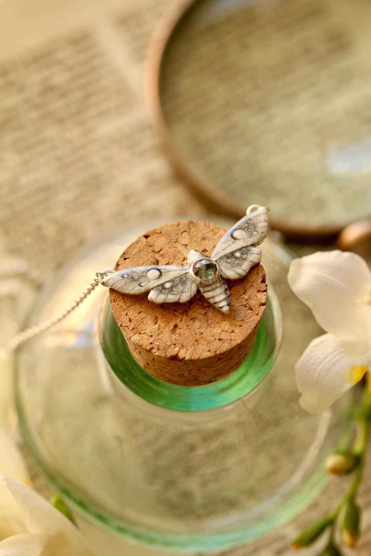 White moth pendant