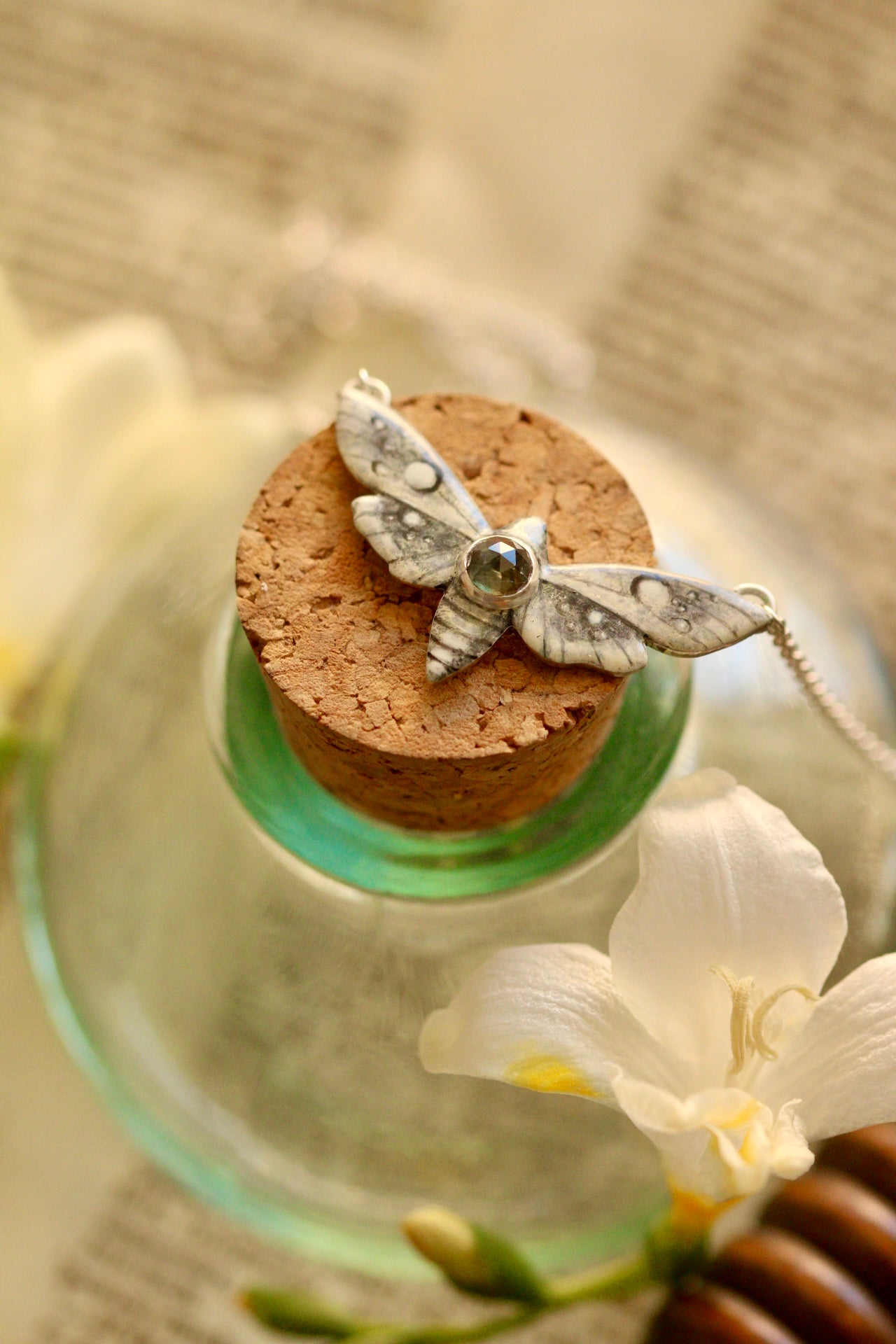 White moth pendant
