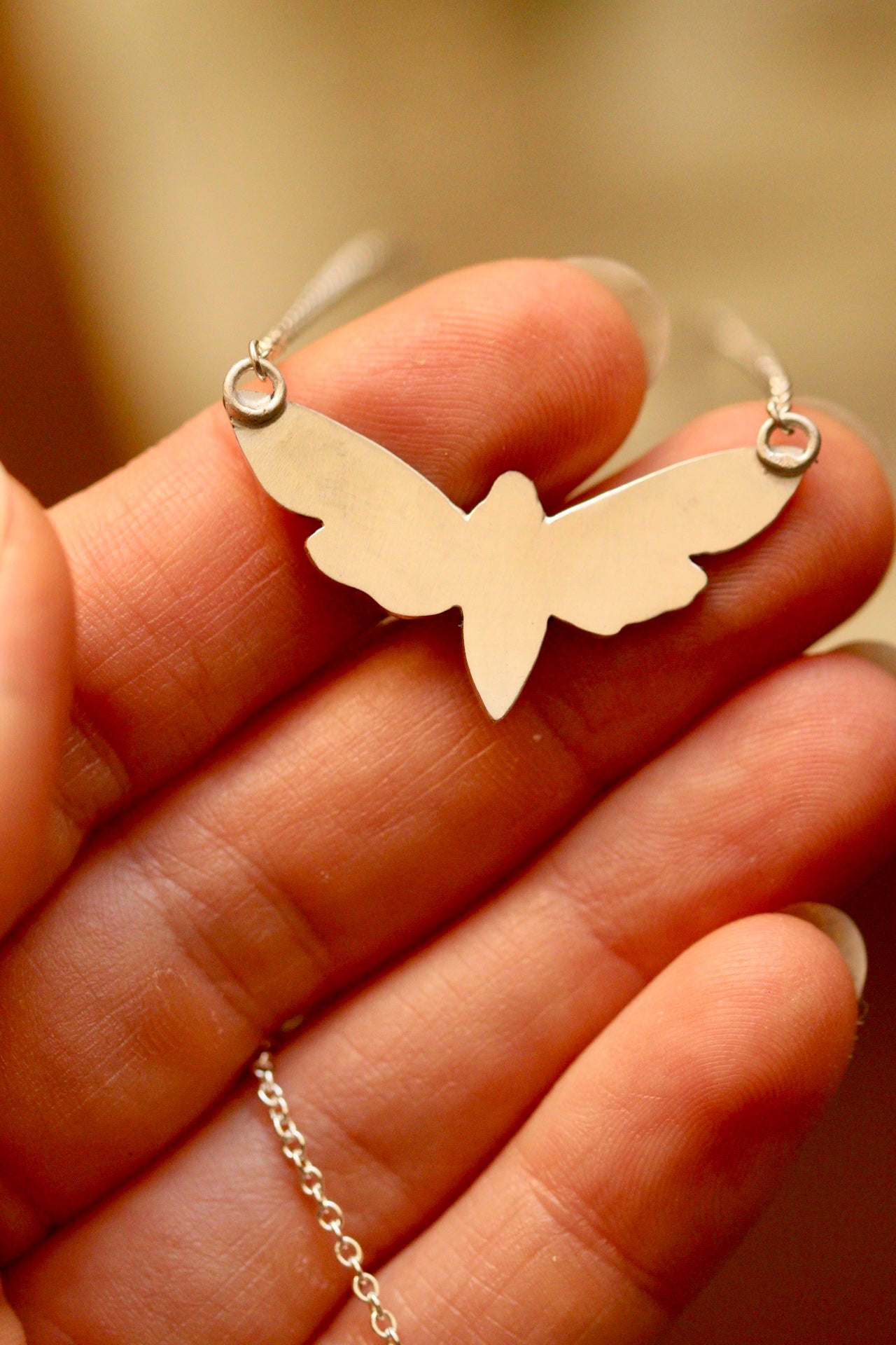 White moth pendant