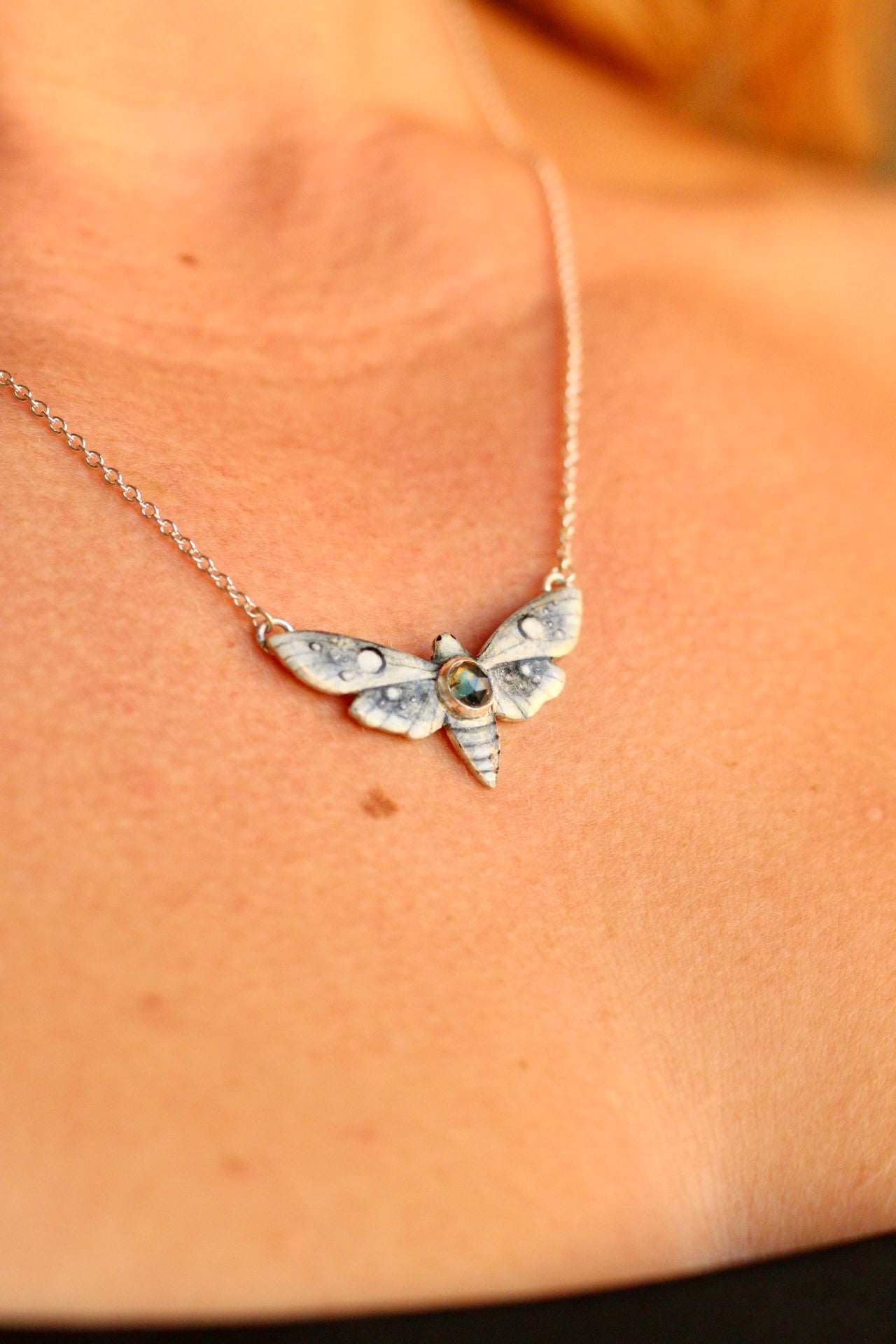 White moth pendant