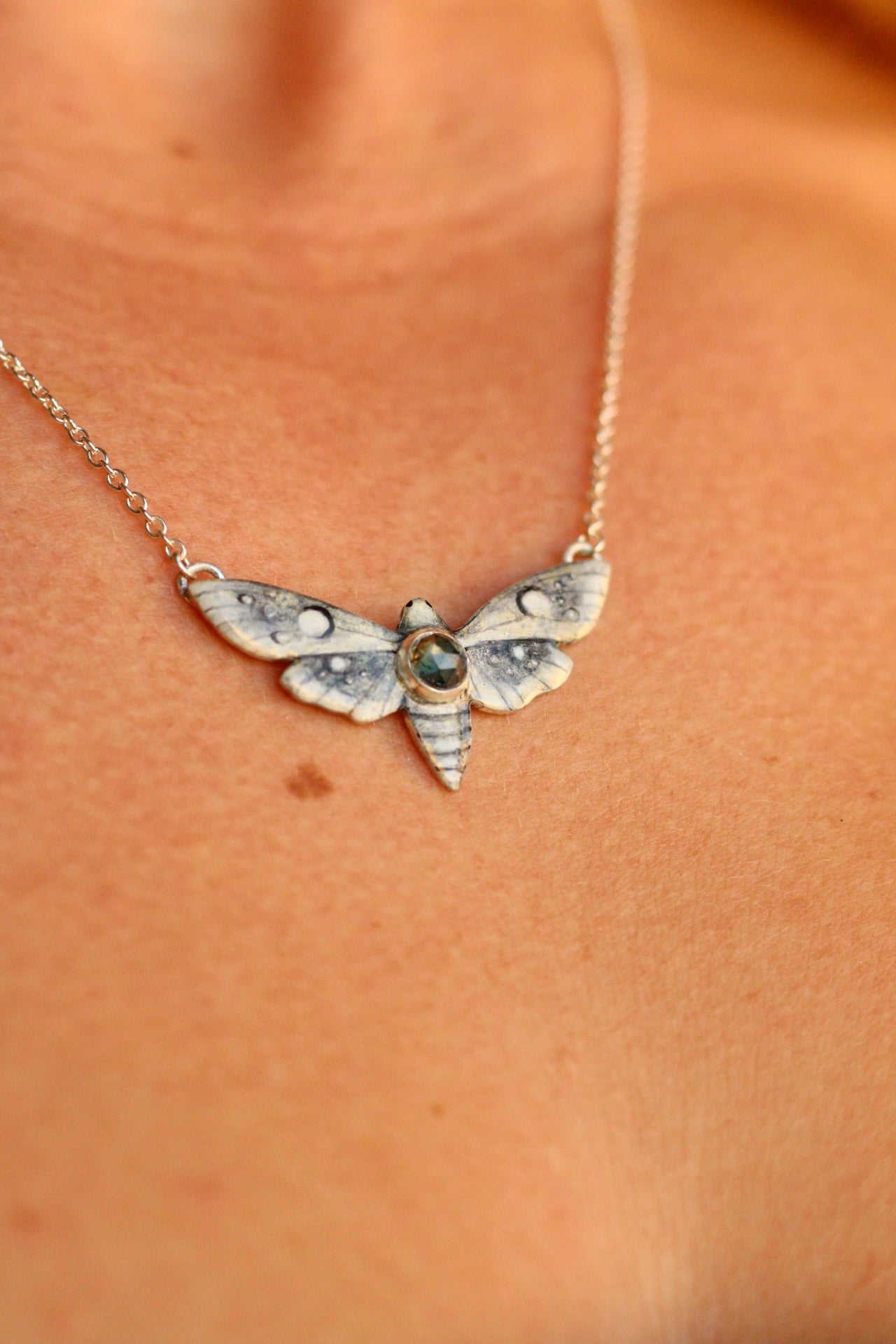 White moth pendant
